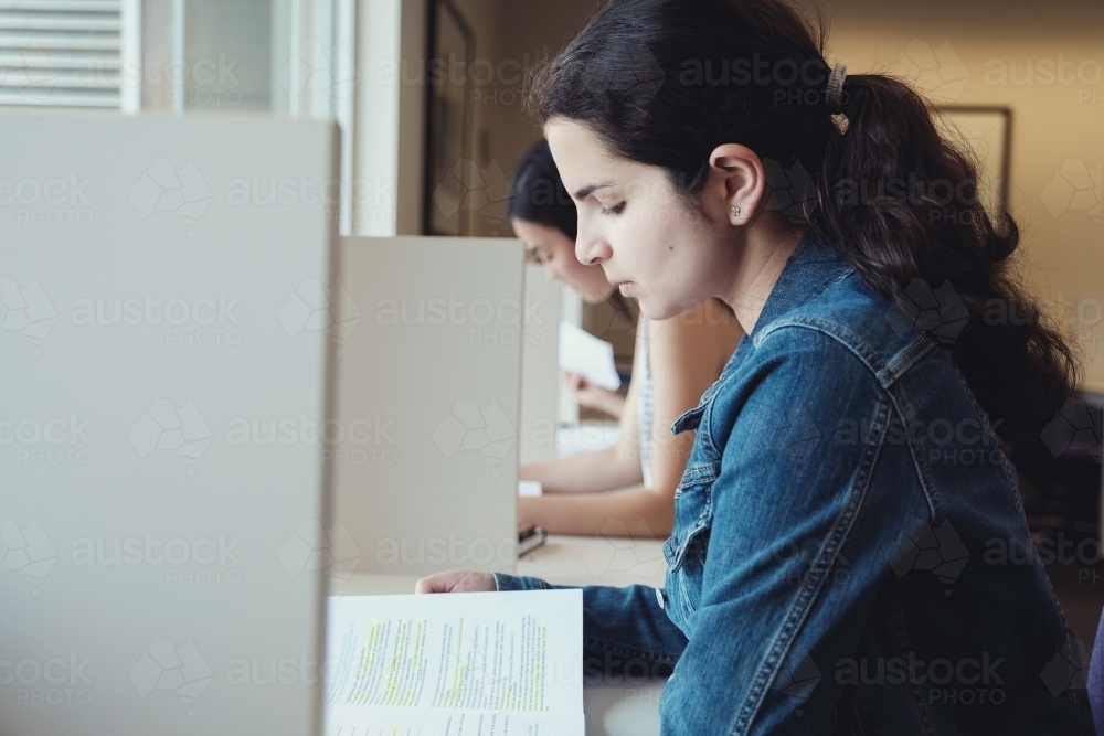 International students studying in university library - Australian Stock Image