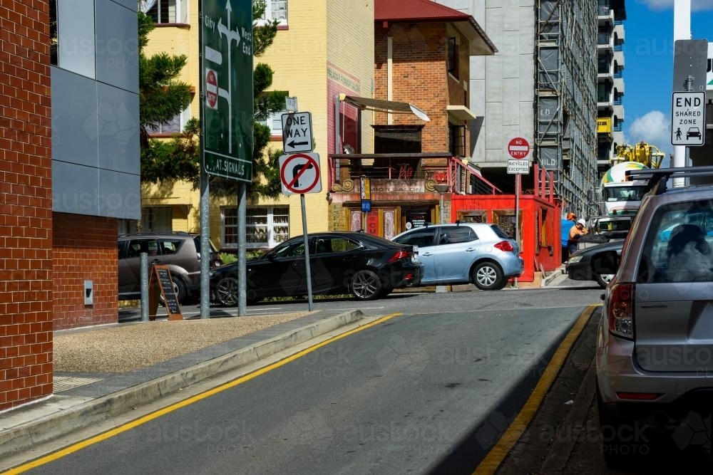 Intersection in the back streets of South Brisbane with traffic and construction work. - Australian Stock Image