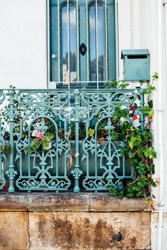Iron fence and letterbox in front of terrace - Australian Stock Image