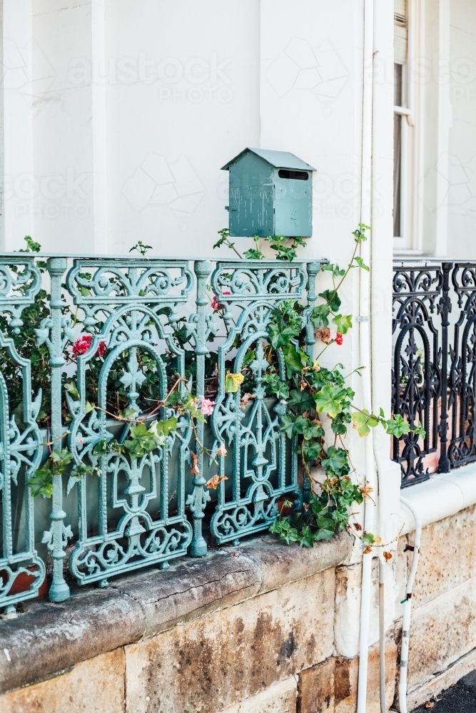 Iron fence and letterbox in front of terrace - Australian Stock Image