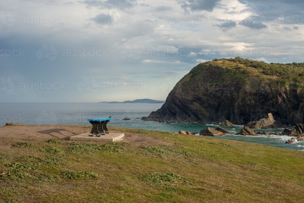 Island wth bench and blue waters - Australian Stock Image