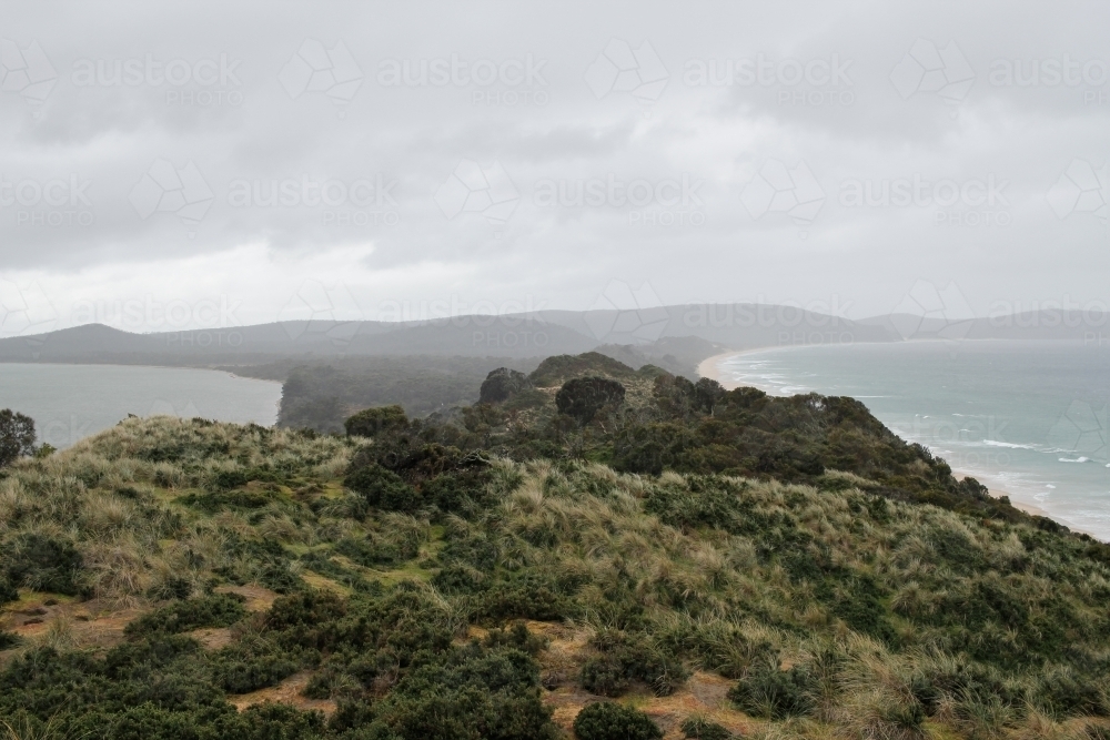 Isolated coastal isthmus, Tasmania - Australian Stock Image