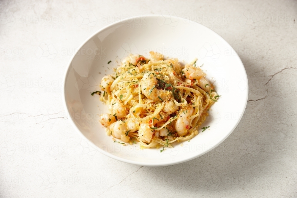 Italian gourmet prawn pasta in bowl - Australian Stock Image