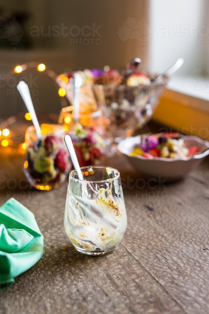 italian trifle dessert, empty glass with spoon - Australian Stock Image