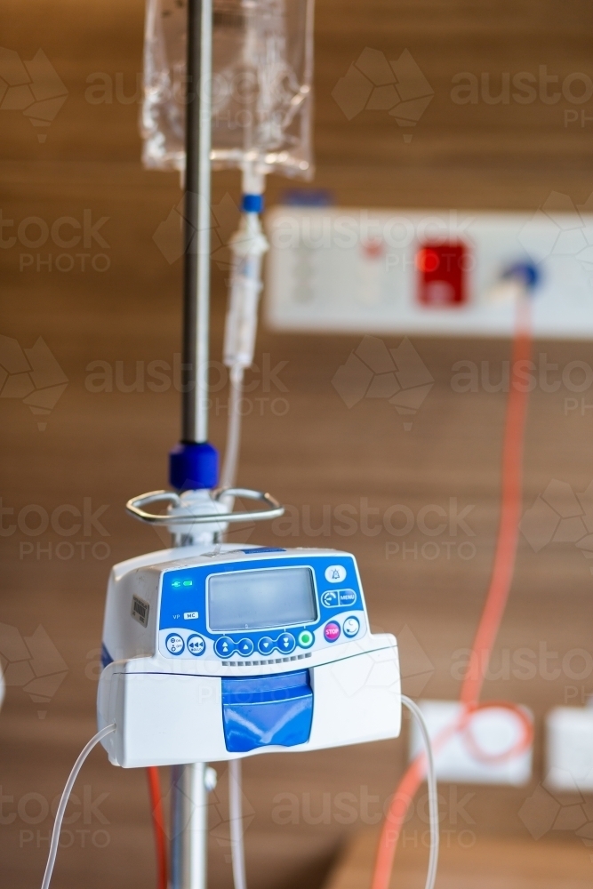 Image of IV medical drip machine in hospital room - Austockphoto