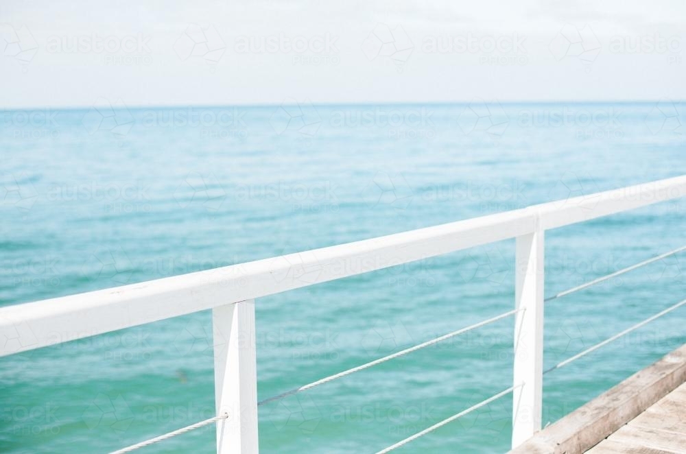 Jetty railing overlooking the ocean - Australian Stock Image
