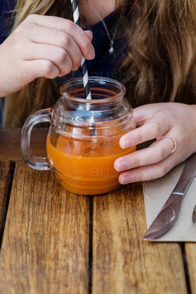 juice with straw - Australian Stock Image