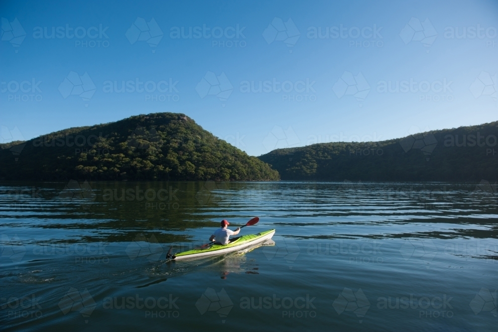 Kayaker paddling on the river - Australian Stock Image