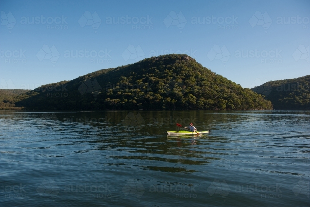 Kayaker paddling on the river - Australian Stock Image