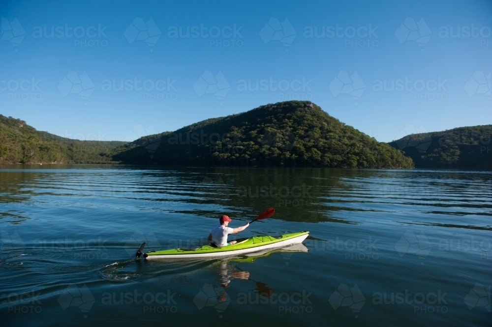 Kayaker paddling on the river - Australian Stock Image