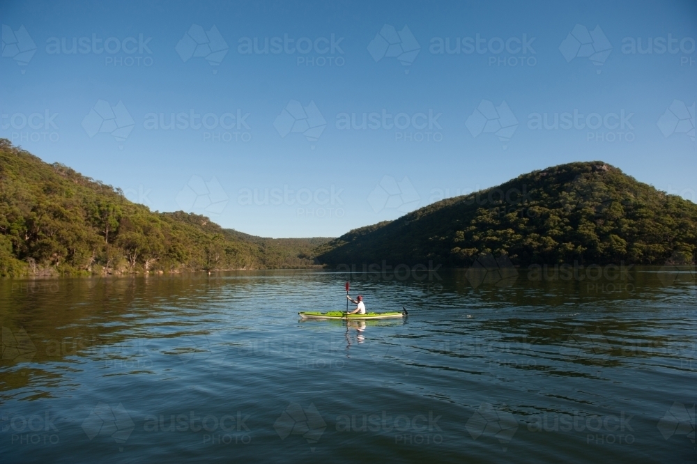 Kayaker paddling on the river - Australian Stock Image
