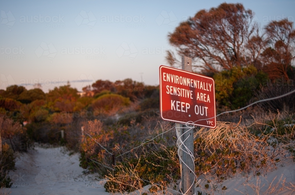 Keep out sign on sand dunes and coastal habitat - Australian Stock Image
