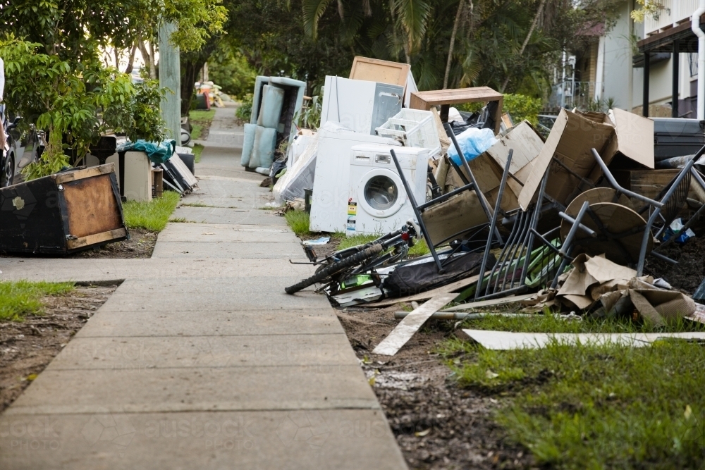 Kerbside waste and rubbish put out for collection after major flooding - Australian Stock Image