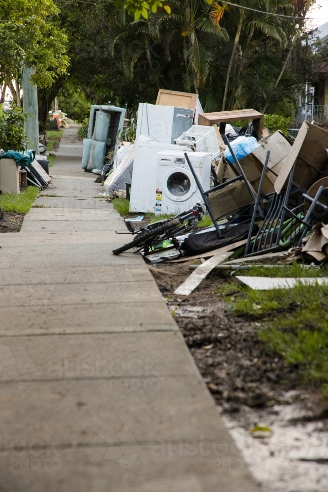 Image of Kerbside waste and rubbish put out for collection after major flooding Austockphoto
