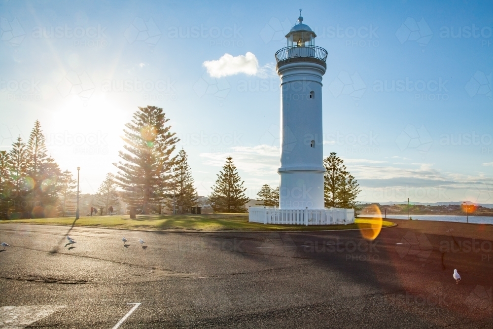Kiama Lighthouse with sun flare in the afternoon - Australian Stock Image
