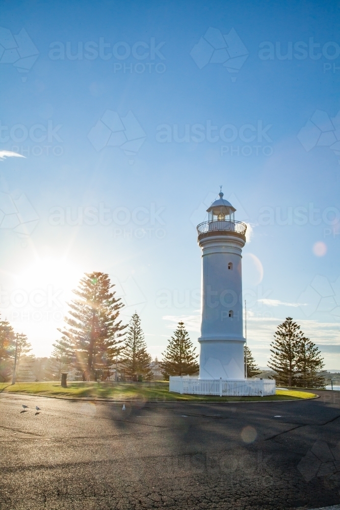 Kiama Lighthouse with sun flare in the afternoon - Australian Stock Image