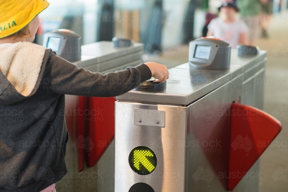 kid using travel card at ferry - Australian Stock Image