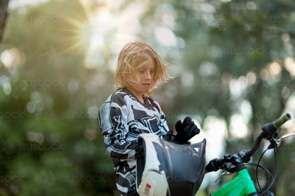 Kid with helmet and bike - Australian Stock Image