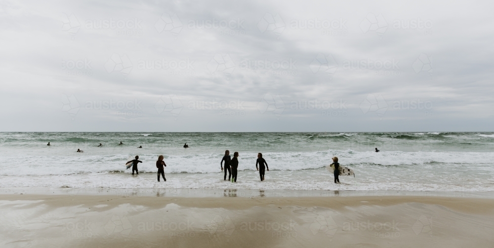 kids going surfing - Australian Stock Image
