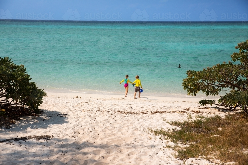 kids near the crystal clear water of the Great Barrier Reef on Heron Island - Australian Stock Image