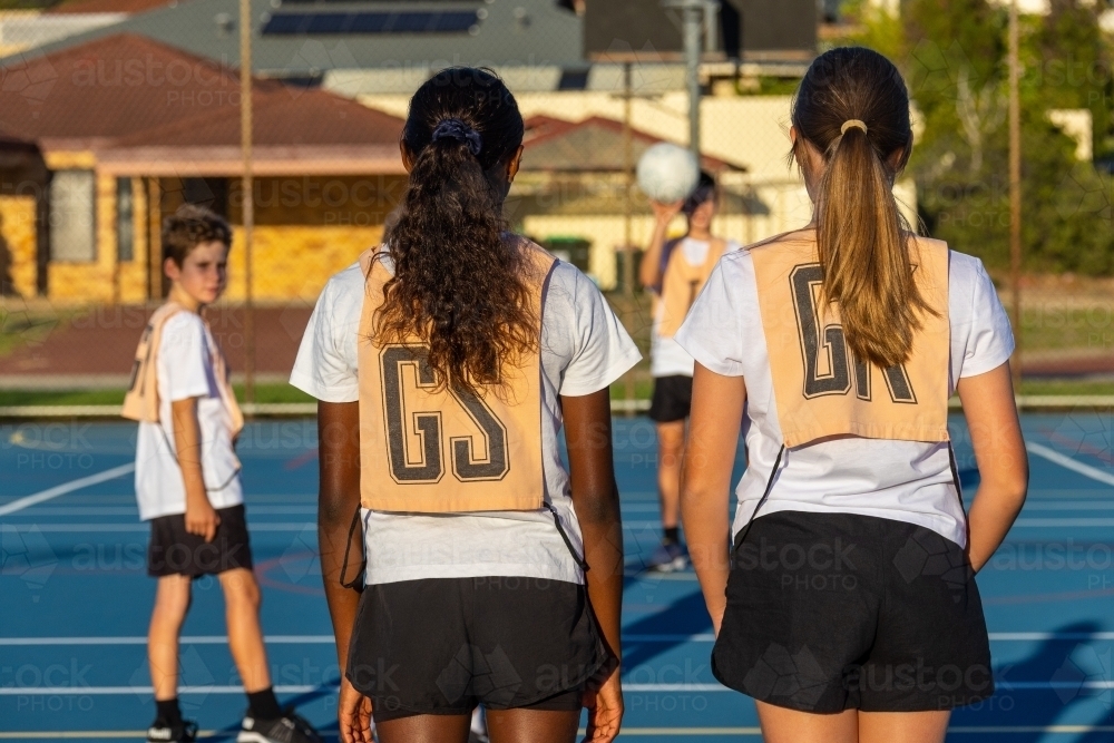 kids netball team on court at training - Australian Stock Image