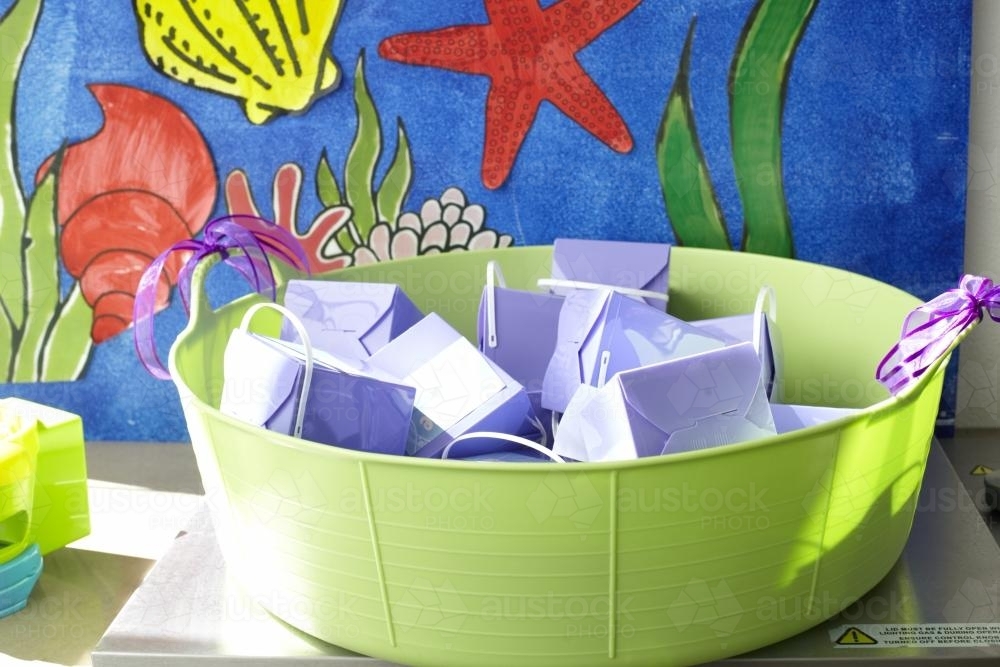 Kids party packs in a green bowl - Australian Stock Image