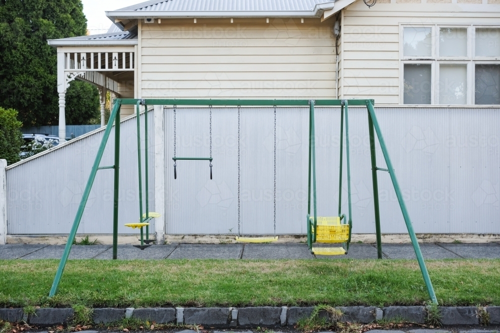 Kids play equipment setup on a nature strip - Australian Stock Image