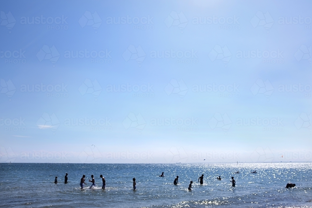 Kids playing in the water in port phillip bay - Australian Stock Image