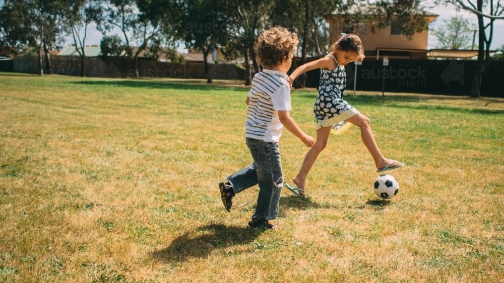 Kids playing soccer - Australian Stock Image