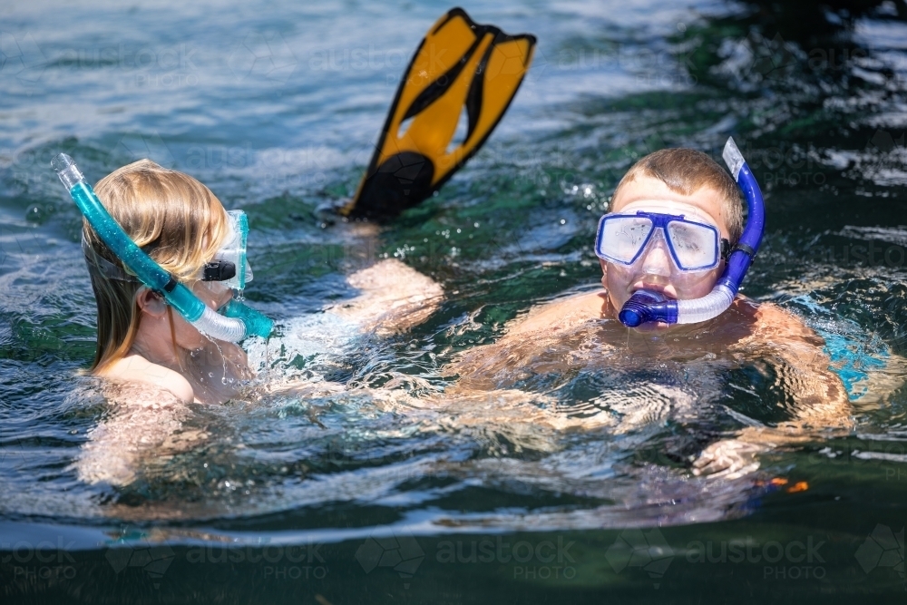 Kids snorkeling in river on summer holiday - Australian Stock Image
