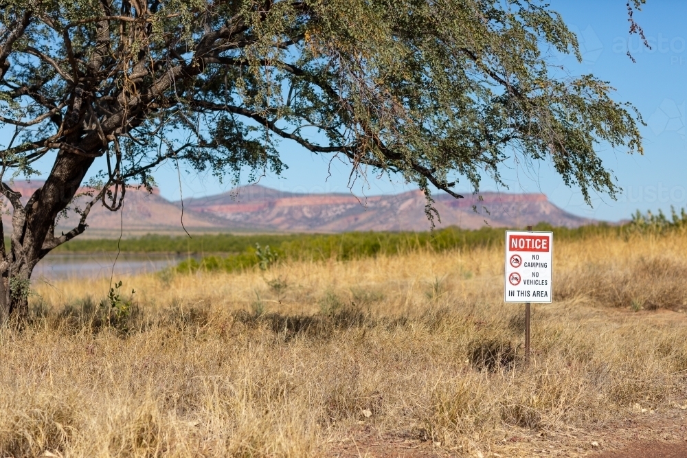 Kimberley landscape with sign advising no camping and no vehicles - Australian Stock Image