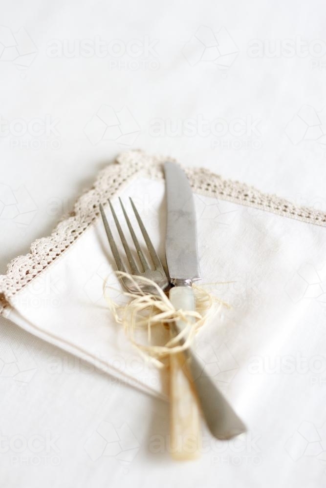 Knife and Fork tied with twine on napkin - Australian Stock Image