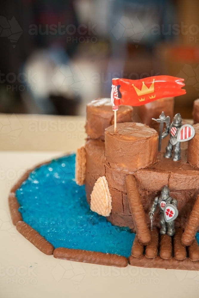 Knights on a fortress castle birthday cake - Australian Stock Image