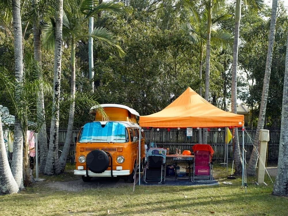 Kombi van and shelter in tropical campground - Australian Stock Image