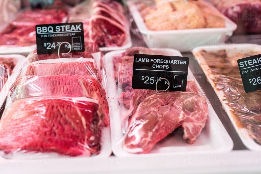 labels on meat in butcher shop - Australian Stock Image
