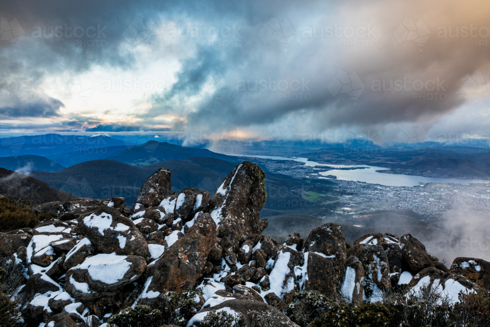 mountain landscape with rocks and snow - Australian Stock Image