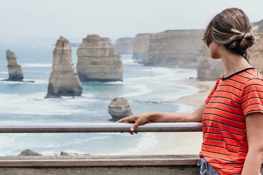 Lady looks towards tourist view at Port Campbell. - Australian Stock Image
