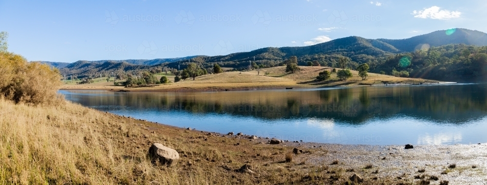 Lake water in Tumut River at low level - Australian Stock Image
