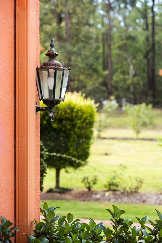 Lamp on side of house wall for outdoor lighting - Australian Stock Image