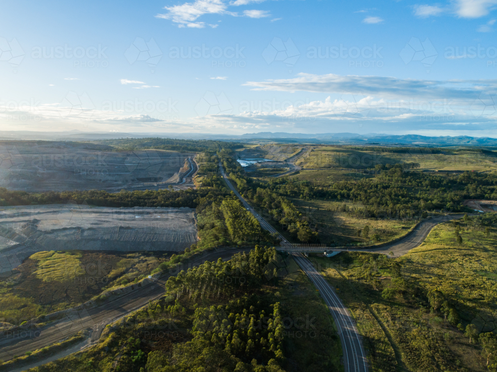 Landscape in hunter valley with open cut coal mine pit on horizon - Australian Stock Image