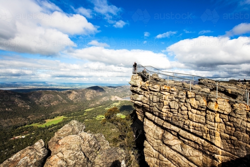 Landscape of people at lookout overlooking valley - Australian Stock Image