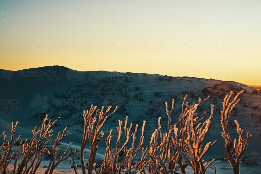 Landscape sunrise of the Snowy Mountains looking across the valley - Australian Stock Image