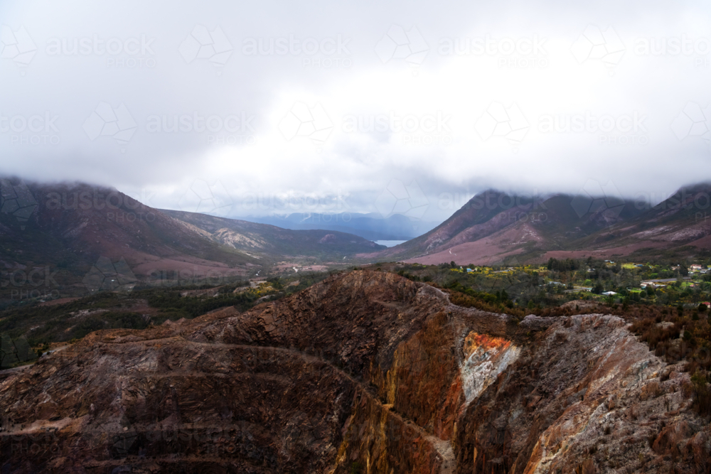 Landscape view of an old open cut mine on a cloudy day, Tasmania - Australian Stock Image
