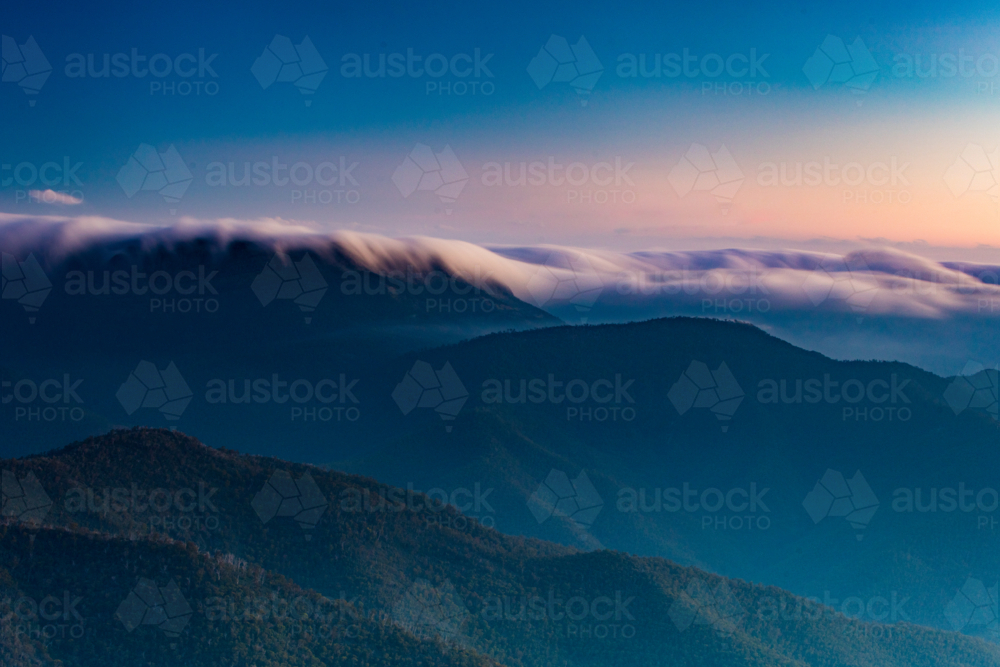 Landscape views of sunset from the summit of Mt Buller over the Victorian Alps in the Victorian High - Australian Stock Image