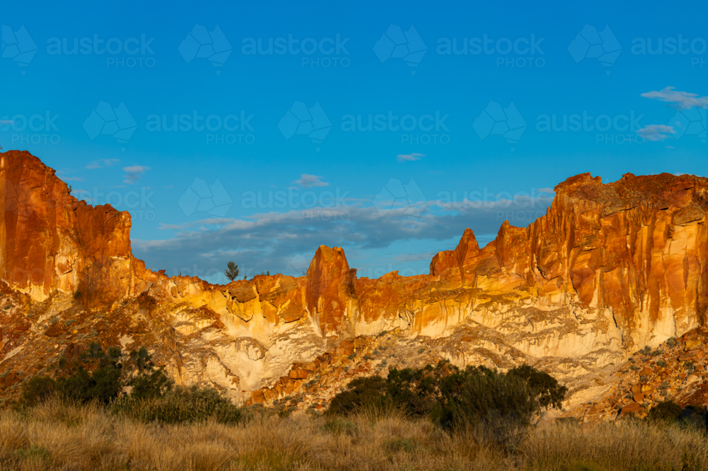 Landscape with Red rocky outcrop at Sunset - Australian Stock Image