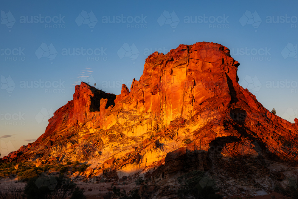 Landscape with Red rocky outcrop at Sunset - Australian Stock Image