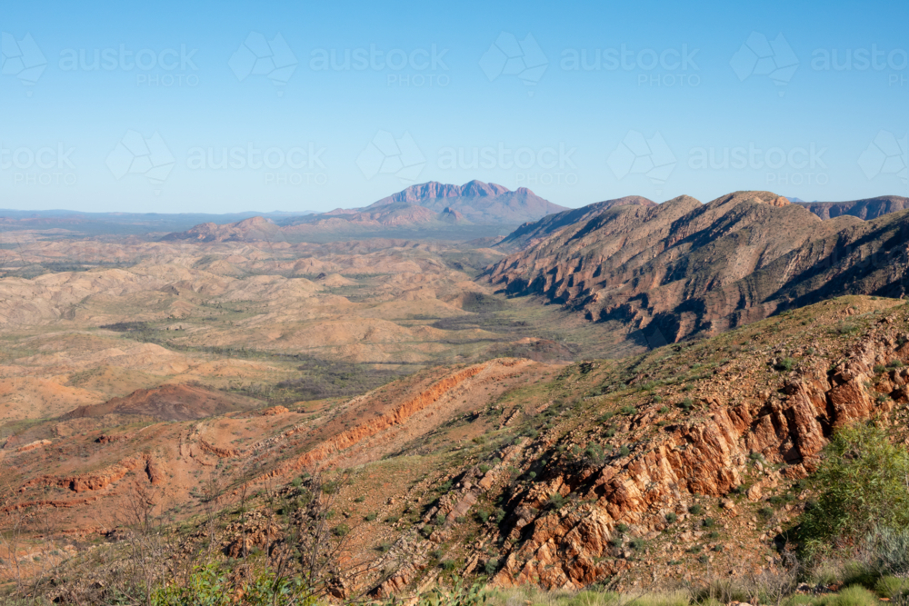 Larapinta Trail view across mountain ranges to Mount Sonder - Australian Stock Image