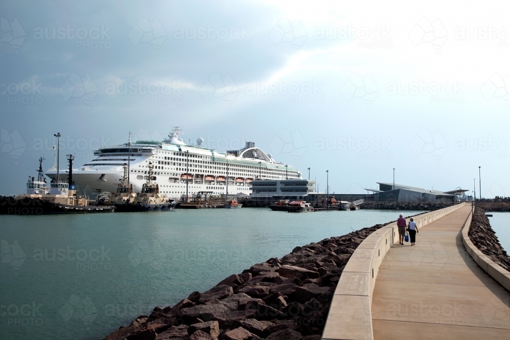 Large cruise liner docked at an industrial port - Australian Stock Image