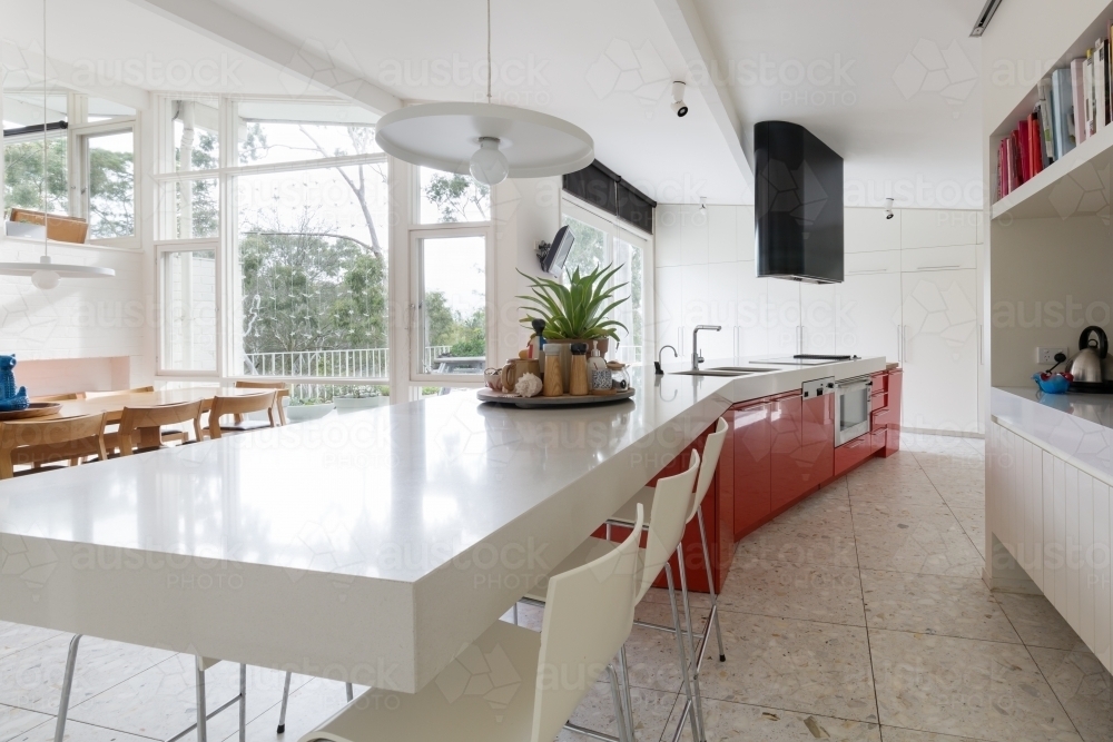 Large designer kitchen in modern home with  garden outlook - Australian Stock Image