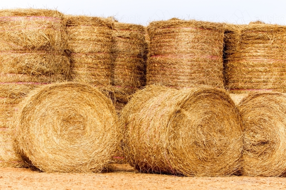 Image of Large hay bales delivered and stacked for drought relief